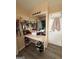Bathroom vanity with a built in dressing table, countertop, storage and a large mirror with decorative lighting at 1631 Royal Ives Dr, Lawrenceville, GA 30045