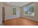 Well-lit bedroom with large windows and hardwood floors at 553 Sommersby Dr, Dallas, GA 30157