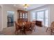 Dining room featuring a large bay window, classic wooden furniture, and ample natural light at 120 Wisteria Ct, Tyrone, GA 30290