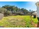 Large backyard with green grass and a wood fence, perfect for outdoor activities and relaxation at 261 Whistle Way, Locust Grove, GA 30248