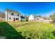 Spacious, well-maintained backyard featuring a large grassy area and a privacy fence at 261 Whistle Way, Locust Grove, GA 30248