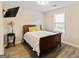Cozy bedroom with wood-look flooring and a TV at 261 Whistle Way, Locust Grove, GA 30248