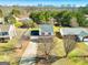 Two story home with a long driveway, red shutters, neutral siding, with mature trees and landscaping at 261 Whistle Way, Locust Grove, GA 30248