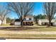Charming two-story home with a well-maintained front yard, brick accents, and a two-car garage at 261 Whistle Way, Locust Grove, GA 30248