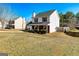 Charming two-story home with a well-maintained front yard, brick accents, and a two-car garage at 261 Whistle Way, Locust Grove, GA 30248