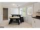Bright kitchen eat-in area features built-in seating and natural light at 261 Whistle Way, Locust Grove, GA 30248
