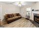 Comfortable living room with a cozy fireplace, neutral tones, modern flooring, and a spacious layout at 261 Whistle Way, Locust Grove, GA 30248