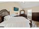 Spacious main bedroom with wood-look flooring and TV at 261 Whistle Way, Locust Grove, GA 30248