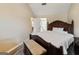 Bright main bedroom featuring a large bed and ample closet space at 261 Whistle Way, Locust Grove, GA 30248