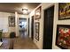 Hallway showcasing artwork and access to other rooms, providing a cohesive and stylish transition space at 1899 Se Cooper Landing Se Dr, Smyrna, GA 30080