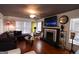 Comfortable living room featuring a fireplace, hardwood floors, and a cozy seating arrangement at 1899 Se Cooper Landing Se Dr, Smyrna, GA 30080