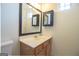 Bathroom features a vanity with storage and a large mirror at 5790 Ridge Stone Way, Cumming, GA 30041