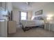 Bedroom with neutral walls and carpet featuring a ceiling fan and a double bed at 5790 Ridge Stone Way, Cumming, GA 30041