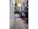 Walk-in closet with ample storage and a variety of clothing and shoes at 5790 Ridge Stone Way, Cumming, GA 30041