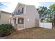 Charming home featuring a covered porch and a white fenced in backyard area at 5790 Ridge Stone Way, Cumming, GA 30041