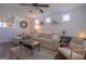 Cozy living room with hardwood floors, neutral-toned furniture, recessed lighting, and natural light at 5790 Ridge Stone Way, Cumming, GA 30041