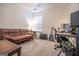 Inviting living room featuring a brown leather sofa and a guitar amplifier for entertainment at 5790 Ridge Stone Way, Cumming, GA 30041