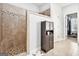 Bathroom featuring a tiled walk-in shower, dark brown cabinet, and tile flooring at 224 Jester Ct, Mcdonough, GA 30252