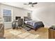 Bedroom with a neutral color palette, bright windows, wood furnishings, and plush carpeting at 224 Jester Ct, Mcdonough, GA 30252