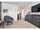 Bedroom with a sitting area, shelving, and a black dresser at 224 Jester Ct, Mcdonough, GA 30252