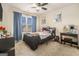 Bright bedroom with a large window, plush carpeting, and a stylish vanity desk at 224 Jester Ct, Mcdonough, GA 30252