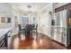 Bright eat-in kitchen with stainless steel refrigerator, breakfast table, and natural lighting at 224 Jester Ct, Mcdonough, GA 30252