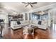 Spacious living room with hardwood floors, coffered ceilings, and an open layout to the kitchen at 224 Jester Ct, Mcdonough, GA 30252