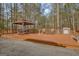 Beautiful deck area with ample seating and wooded views at 130 Kingsbrooke Cir, Palmetto, GA 30268