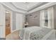 Bedroom boasting tray ceilings and natural light from the windows at 130 Kingsbrooke Cir, Palmetto, GA 30268