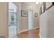 Bright hallway with hardwood floors and access to the main bedroom at 130 Kingsbrooke Cir, Palmetto, GA 30268