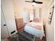 Charming bedroom with ceiling fan, comfortable bed, and stylish decor at 2508 Sylvan Rd, East Point, GA 30344