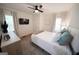 Inviting bedroom with a ceiling fan, a TV, two windows, and a neutral color scheme at 2508 Sylvan Rd, East Point, GA 30344