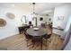 The dining room is adjacent to living room, features modern decor and wood floors at 2508 Sylvan Rd, East Point, GA 30344