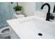 Modern bathroom vanity featuring white countertops and sleek black fixtures, enhancing the bathroom's contemporary appeal at 2508 Sylvan Rd, East Point, GA 30344