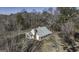 Charming home featuring a metal roof and covered porch, nestled amidst trees at 128 Turner Ln, Bowdon, GA 30108
