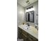 Cozy bathroom featuring a vanity with a sink, wood cabinets, and modern lighting at 128 Turner Ln, Bowdon, GA 30108