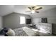 Cozy bedroom featuring a ceiling fan, natural light from the window, and stylish decor at 128 Turner Ln, Bowdon, GA 30108