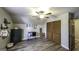 Attic bedroom featuring wood floors, built-in storage, window and ceiling fan at 128 Turner Ln, Bowdon, GA 30108