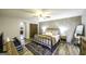 Bedroom featuring plank accent wall, a ceiling fan, a guest daybed, and wood floors at 128 Turner Ln, Bowdon, GA 30108