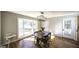 Cozy dining area with a bay window, hardwood floors, and modern lighting at 128 Turner Ln, Bowdon, GA 30108