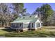 Charming home with a green roof and a cozy screened-in porch, perfect for relaxing outdoors at 128 Turner Ln, Bowdon, GA 30108