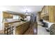 Spacious kitchen featuring wood cabinets, stainless steel appliances, and a large central island at 128 Turner Ln, Bowdon, GA 30108