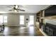 Inviting living room showcasing wood floors, a cozy fireplace and lots of windows at 128 Turner Ln, Bowdon, GA 30108
