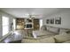 Spacious living room featuring wood floors, ceiling fan, built-in shelves and a fireplace at 128 Turner Ln, Bowdon, GA 30108
