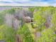 Aerial view of a brick home on a large wooded lot at 233 Spear Rd, Fayetteville, GA 30215