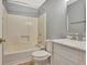 Full bathroom with a tub, toilet, and marble top vanity at 233 Spear Rd, Fayetteville, GA 30215