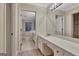 Bathroom featuring a vanity with generous counter space and a tub at 233 Spear Rd, Fayetteville, GA 30215
