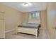 Cozy bedroom with neutral carpet, a bed, and natural lighting at 233 Spear Rd, Fayetteville, GA 30215