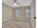 Bright bedroom with carpet, a ceiling fan, and good natural lighting at 233 Spear Rd, Fayetteville, GA 30215