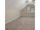 Spacious bedroom with neutral carpet, ceiling fan, and a large window at 233 Spear Rd, Fayetteville, GA 30215